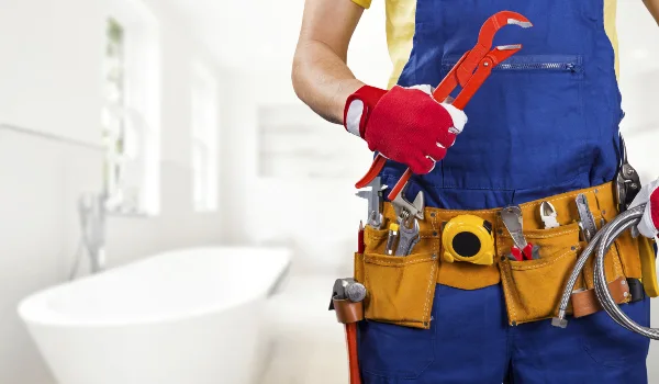the torso of a plumbing technician showing a tool belt in Leander, TX - Kitchen Plumbing Redesign the torso of a plumbing technician showing a tool belt in Leander, TX - Kitchen Plumbing Redesign